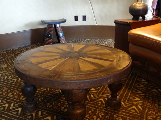 This item is not only a table. A king in Africa gave this wagonwheel to Disney as a gift - the Imagineers turned into a table for the King's Room (Royal Room)