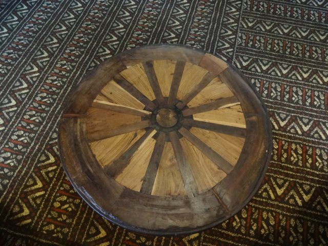 The wooden wagon wheel created a beautiful table
