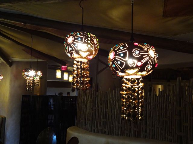 These lights (in the small dining area to the right) are made of hollowed out and carved gourds, decorated with bits of colored glass & seeds & nuts