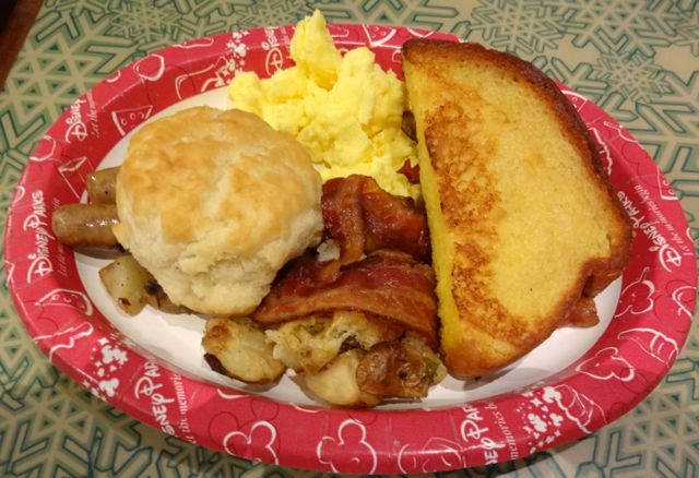 Breakfast! Scrambled eggs, sausage, bacon, potatoes, french toast, and biscuit