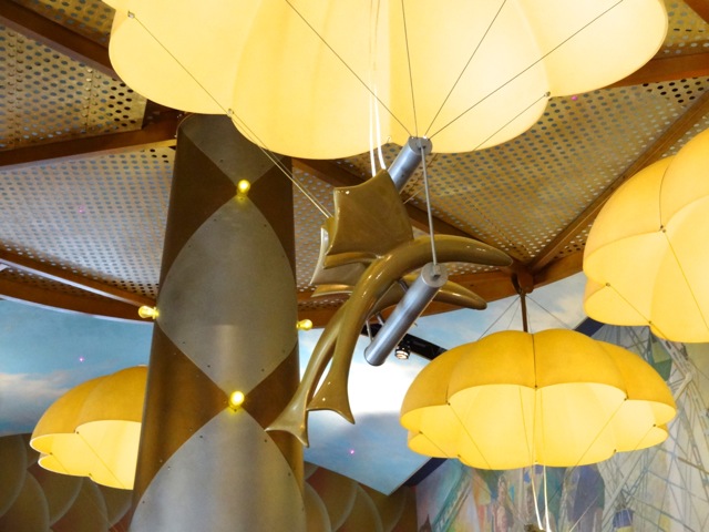 Light fixtures are themed as flying fish with parachutes