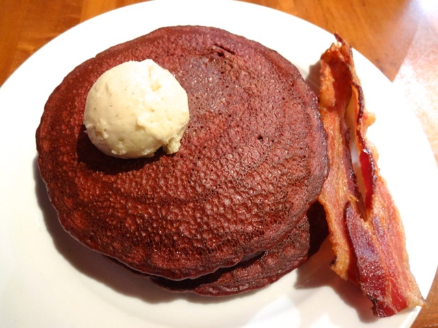 Red Velvet Pancakes with a side of bacon (2 slices)