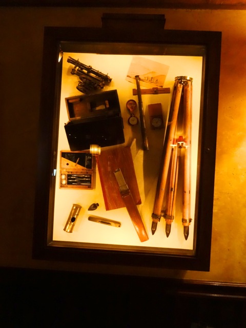 There are a number of display cases on the wall at Territory Lounge, this one contains Surveying Tools. There are others that contain artifacts dedicated to Teddy Roosevelt (because he revamped the National Parks), to photography during the late 1800's, and to the trappers who caught food and furs.
