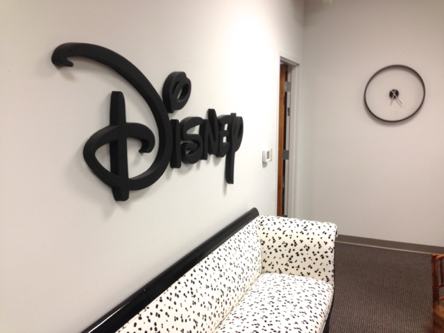 Just in case you forgot where you are, a big Disney sign and a Dalmatian spotted sofa