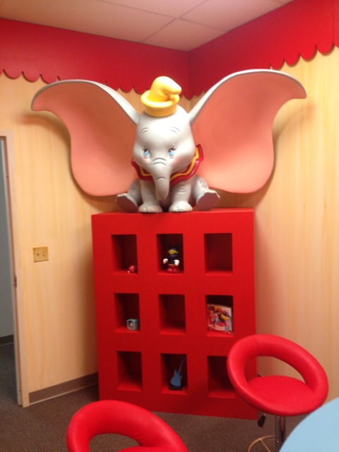 ...Dumbo preparing to fly atop her storage unit...