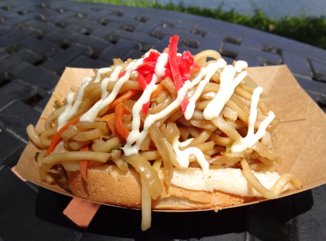 YakiSoba Pan - Fresh grilled carrots, onions, and cabbage with Japanese noodles and teriyaki sauce served on a bun with mayonnaise and Beni Shoga