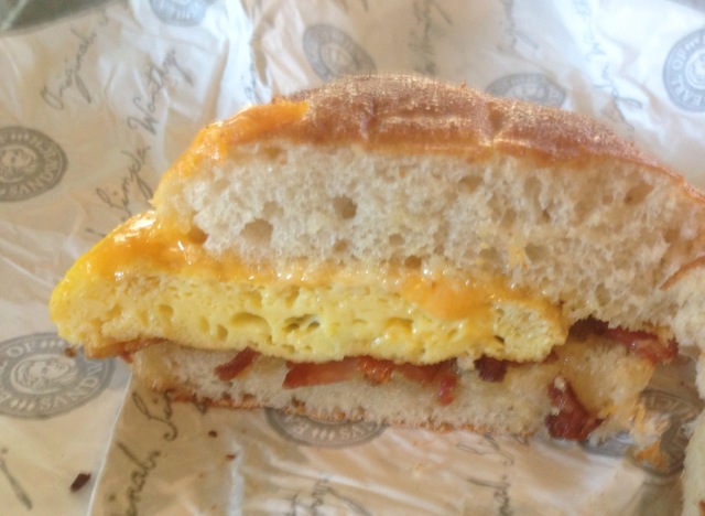 close up of Bacon, Egg & Cheddar breakfast sandwich