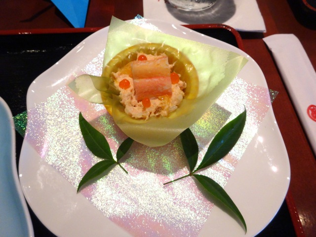crab and salmon in an orange bowl