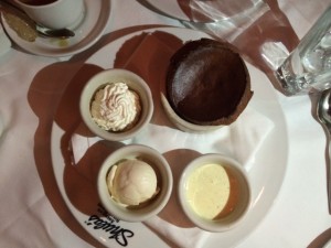 Chocolate Souffle, vanilla ice cream, vanilla whipped cream, and cream anglaise with vanilla